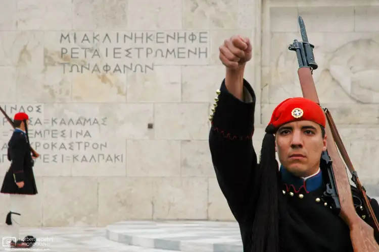 Evzones (Presidential Guard Soldiers) outside the Hellenic Parliament on Syntagma Square in Athens, Greece.