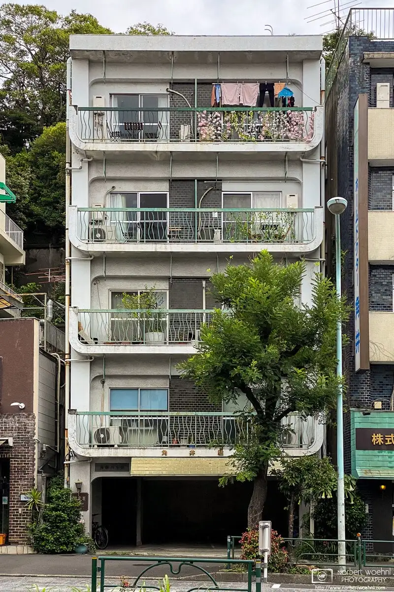 A colorful balcony on the upper floor of this apartment building in the Azabu-juban area of Minato Ward in Tokyo, Japan.