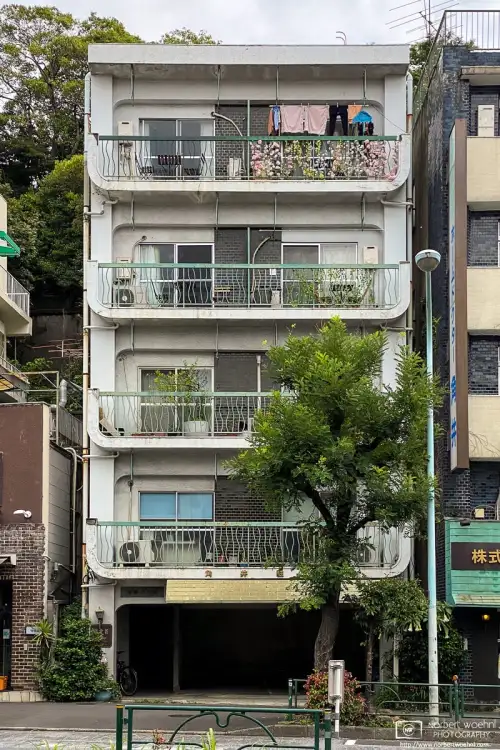 A colorful balcony on the upper floor of this apartment building in the Azabu-juban area of Minato Ward in Tokyo, Japan.