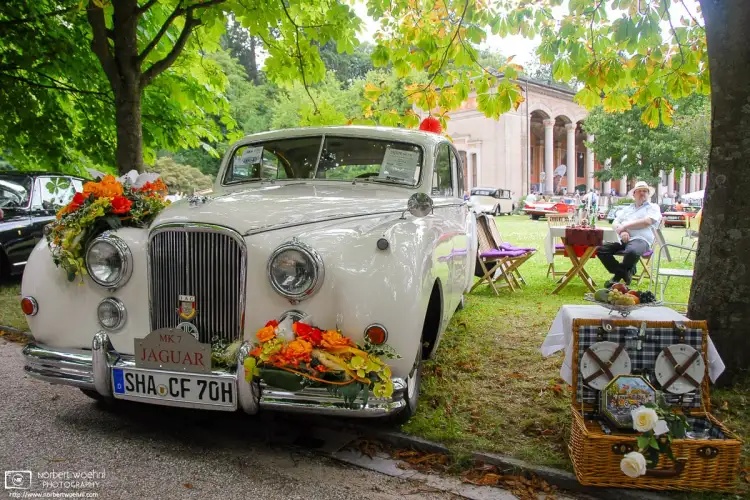 A Jaguar MK 7, its shy owner and various accessories as seen at a Classic Car Show in Baden-Baden, Germany.