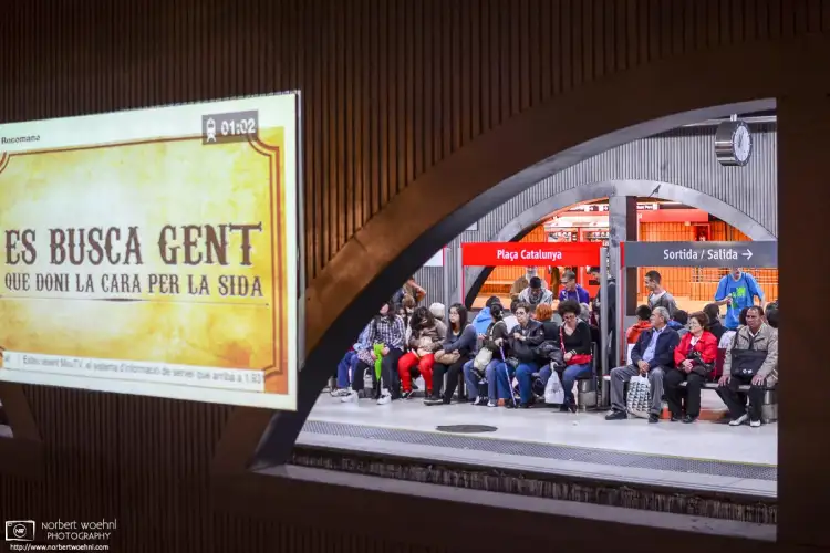Waiting for the train at Plaça de Catalunya Station, the main transportation hub in Barcelona, Spain.
