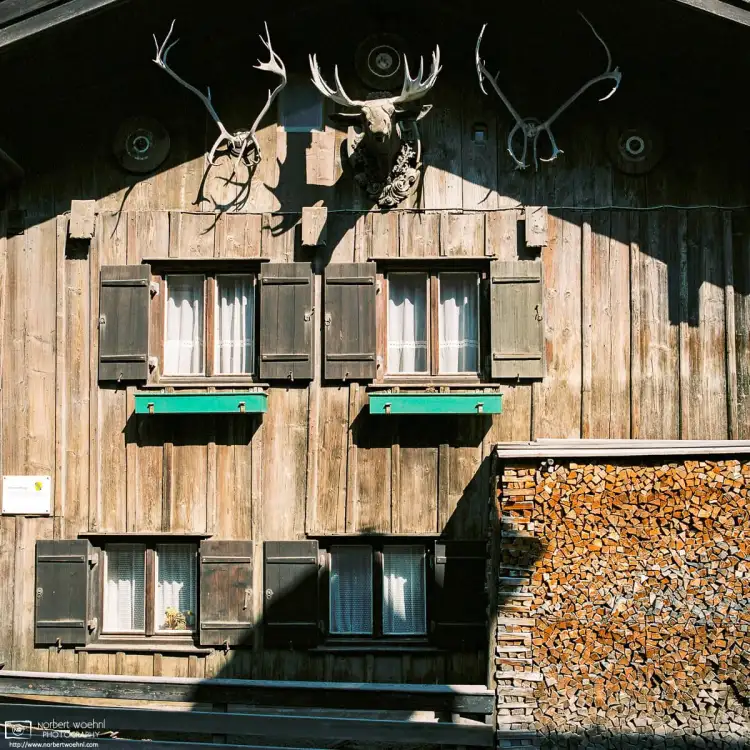 Exterior of a traditional Bavarian building, adorned with deer antlers, in the village of Bernried along Lake Starnberg.