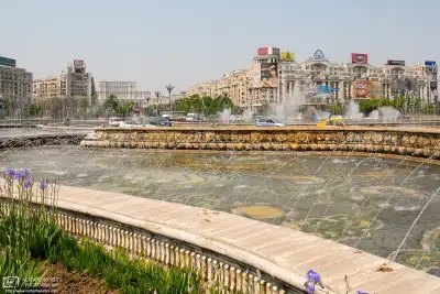 Fountain and traffic in the Piața Unirii (Union Square) area of Bucharest, Romania