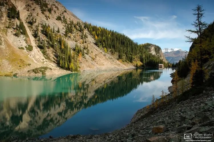 View across Lake Agnes at Banff National Park in Alberta, Canada. Lake Agnes Teahouse is visible in the back of the scene.