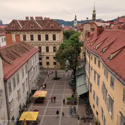 View of Schlossbergplatz and historic buildings in the city center of Graz, Austria.
