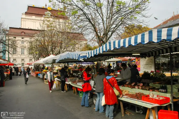 A stroll around the farmers market on Kaiser-Josef-Platz in Graz, Austria, with the Opera House in the background.