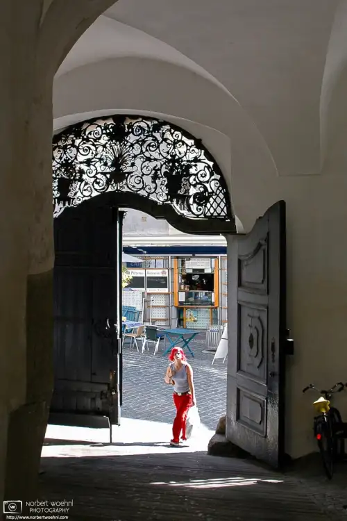 Whilst I was just taking some architectural photos at the beautiful interior yard of Palais Saurau in Graz, Austria, a woman with striking red hair walked in.