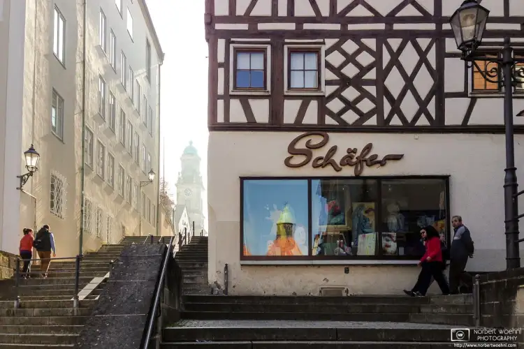 Climbing the stairs to St. Jakobus Collegiate and Parish Church in the old town of Hechingen, Germany.