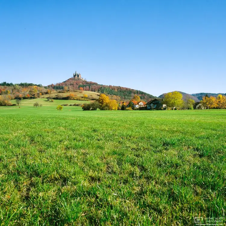 An autumnal scene around Hohenzollern Castle, the ancestral seat of the Hohenzollern family in Southwestern Germany.