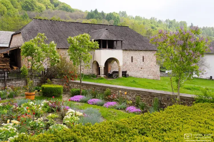 A herb garden in the peaceful setting of Horezu Monastery, a UNESCO World Heritage site in Wallachia, Romania.