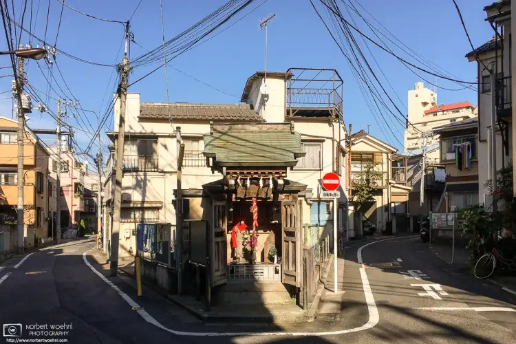 A small shrine in an old residential area around Ikebukuro Honcho in the Toshima Ward of Tokyo, Japan.