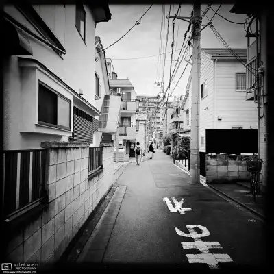 Monochrome photo of a quiet backstreet scene in the Itabashi Ward of Tokyo, Japan.