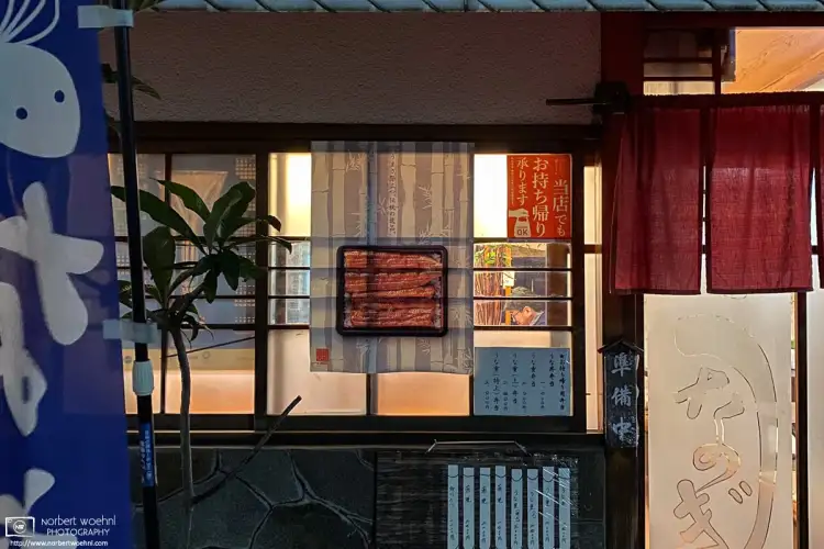 A customer is seen through the window of a grilled-eel restaurant in the Itabashi Ward of Tokyo, Japan.
