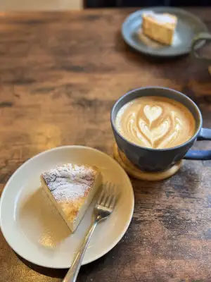 Caffe Latte and Basque Cheesecake at Little Bean Works, a local cafe in the Azusawa district of Itabashi Ward in Tokyo, Japan.