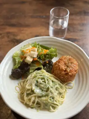 Main dish of Seaweed Cream Pasta, Chicken Rice and side salad at Little Bean Works, a local cafe in the Azusawa district of Itabashi Ward in Tokyo, Japan.