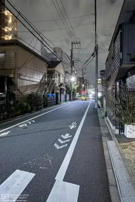 Night photo from a quiet backstreet in the Azusawa district of Itabashi Ward of Tokyo, Japan.