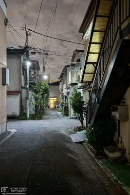 Night photo from a quiet backstreet in the Azusawa district of Itabashi Ward of Tokyo, Japan.