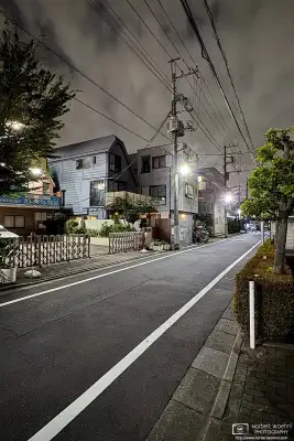 Night photo from a quiet backstreet in the Azusawa district of Itabashi Ward of Tokyo, Japan.