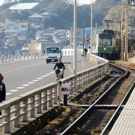 An Enoden (Enoshima Electric Railway) Train is approaching Kamakurakokomae Station in Kanagawa Prefecture. Sections of the line run close to the Shonan Coast.