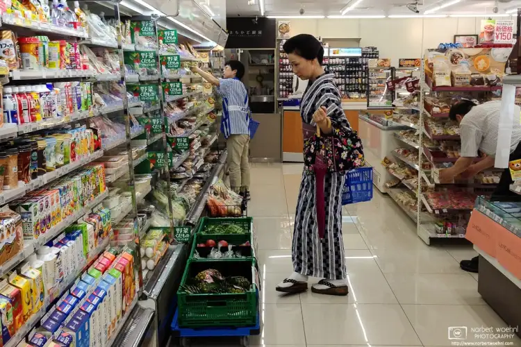 At a convenience store in Kanazawa, Japan, I was just getting some bottled tea when I noticed this rather fashionable customer shopping in the aisle beside me.