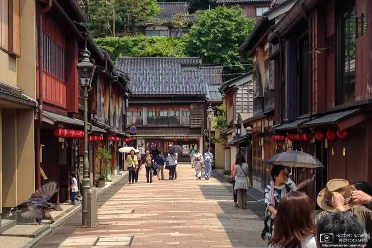 Walking along the Central Street of the historic Higashi Chayagai District in Kanazawa, Japan.