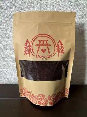 A 100 gram bag of Uno Cafe original espresso roast.