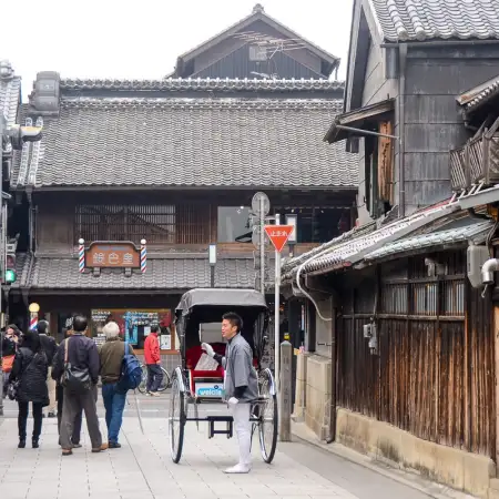 Amidst the historic warehouses of Kawagoe in Saitama Prefecture, Japan, a jinricksha driver is soliciting customers to fill his next tour.