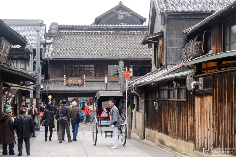 Amidst the historic warehouses of Kawagoe in Saitama Prefecture, Japan, a jinricksha driver is soliciting customers to fill his next tour.