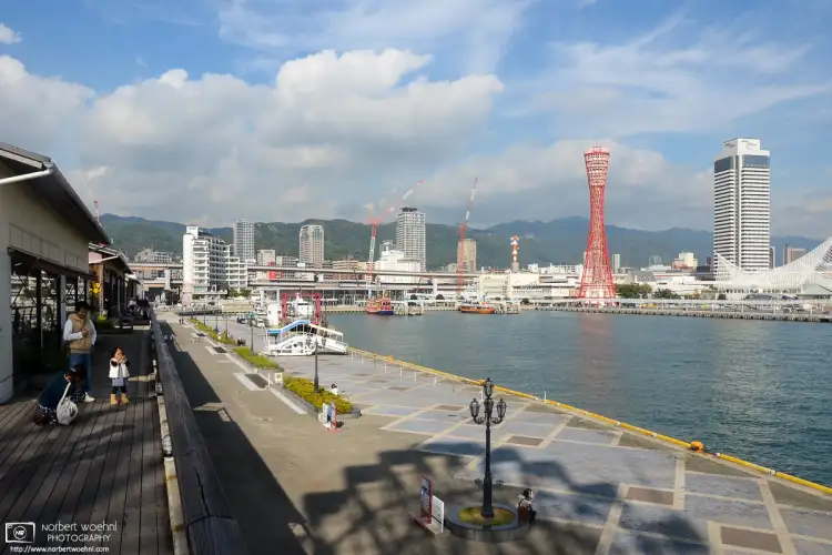 Taken from the upper level of the Mosaic Shopping Complex at Kobe Harborland, Japan, this view looks northeast towards Kobe Port Tower.
