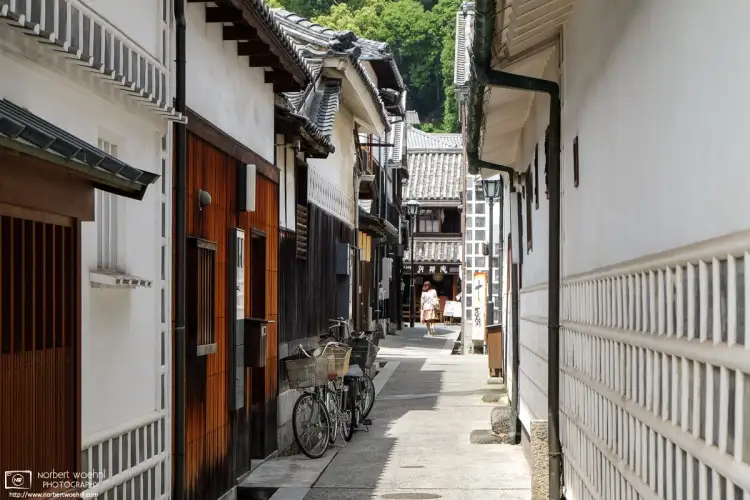 A view along a side street in the heart of the historic Bikan District of Kurashiki in Okayama Prefecture, Japan.