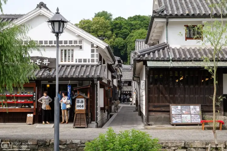 Restaurants at a street corner in the historic Bikan district of Kurashiki in Okayama Prefecture, Japan.