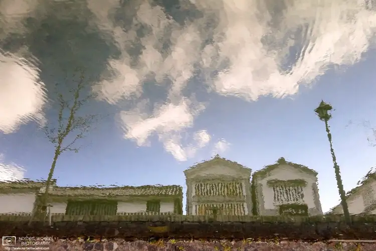 In the Bikan historical quarter of Kurashiki in Okayama Prefecture, Japan, Edo-era storehouses are being reflected off of the surface of a canal.