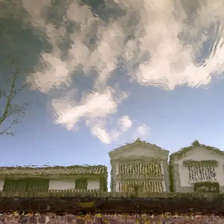 In the Bikan historical quarter of Kurashiki in Okayama Prefecture, Japan, Edo-era storehouses are being reflected off of the surface of a canal.
