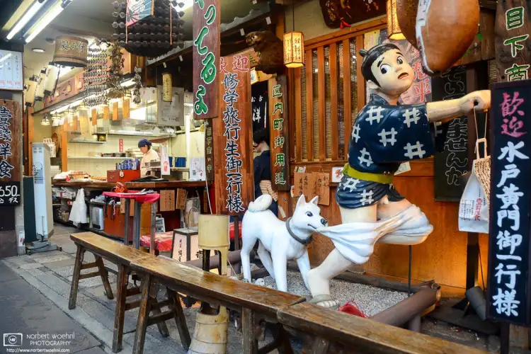 Figure display outside Issen Yoshoku, a restaurant on Nawate-dori in the Gion district of Kyoto, Japan.