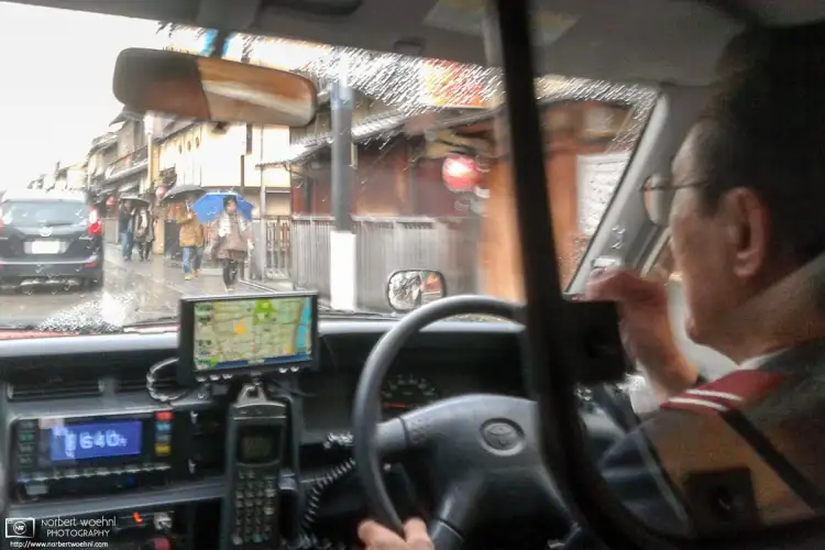 During heavy rain in Kyoto, Japan, this photo was taken on a taxi ride through the Gion district.