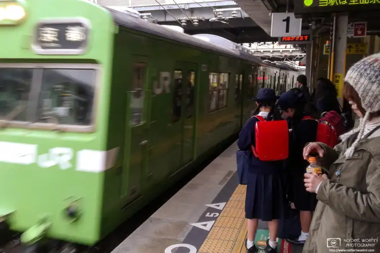 A Kyoto-bound Nara Line train arrives at Tōfukuji Station in Kyoto, Japan.