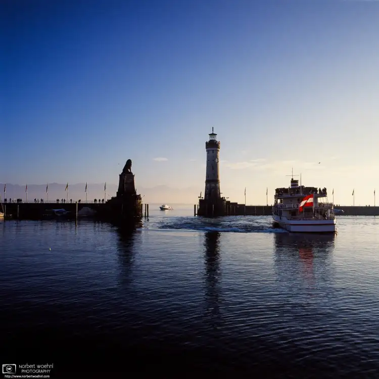 A winter afternoon scene at the Port of Lindau on Lake Constance, Germany.