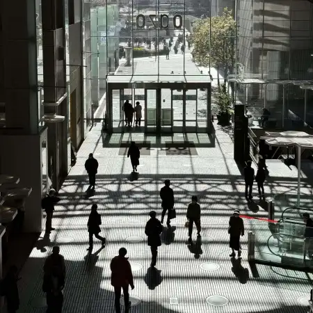 The mid-day sun is doing some artistic work on the concourse of the Marunouchi Oazo Building in Tokyo, Japan.