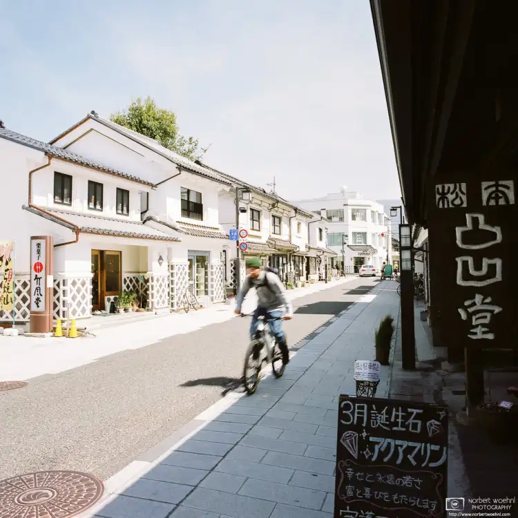 A scene from Nakamachi-dori, the main street traversing a district of well-preserved merchant houses in Matsumoto, Nagano Prefecture, Japan.