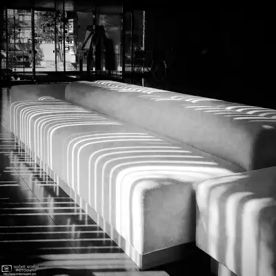 At a hotel lobby in Nagano, Japan, sunlight falling through the blinds is creating patterns on the interior decoration.