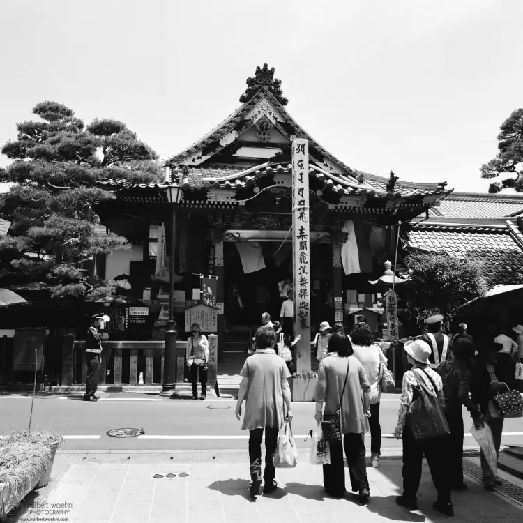 Visitors are approaching Seson-in, a small temple in close proximity to the iconic Zenkoji Temple of Nagano, Japan.