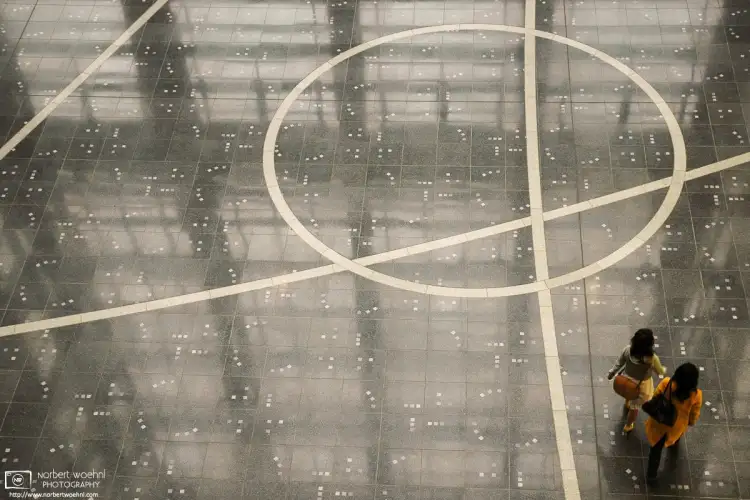 Floor patterns and reflections inside Nadya Park, an office and commercial complex in downtown Nagoya, Japan.
