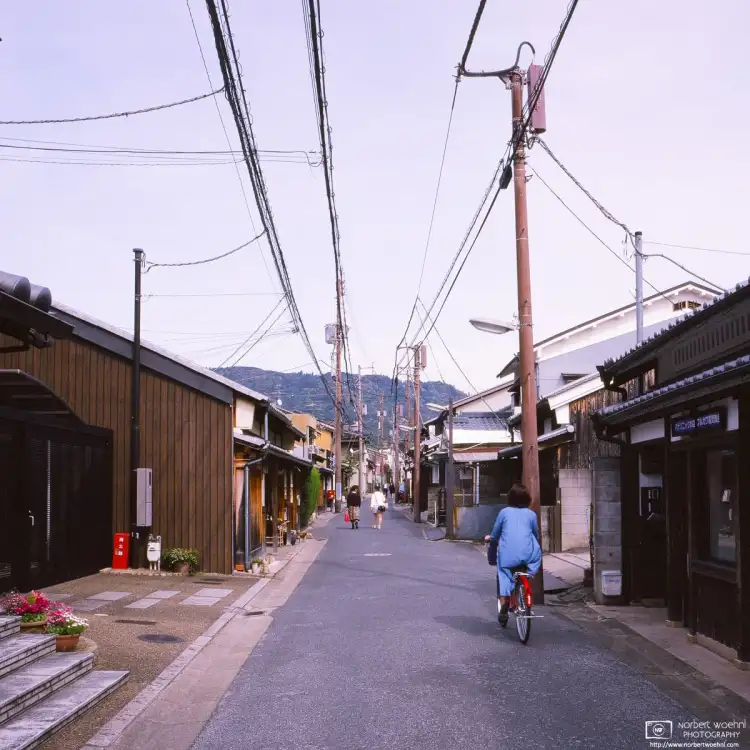 Walking along a quiet side street in the Naramachi area of Nara, Japan. Shot on 16-years-expired Fuji Astia slide film.