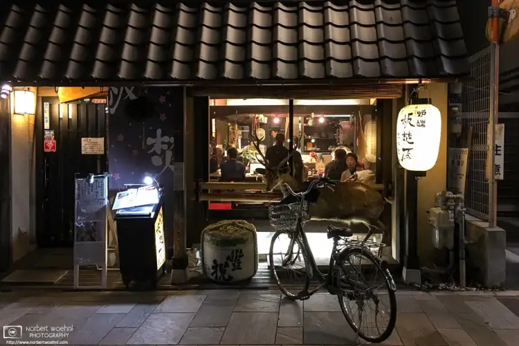 Nighttime exterior of an Izakaya (Japanese-style pub) on Sanjo-dori Street in Nara, Japan.