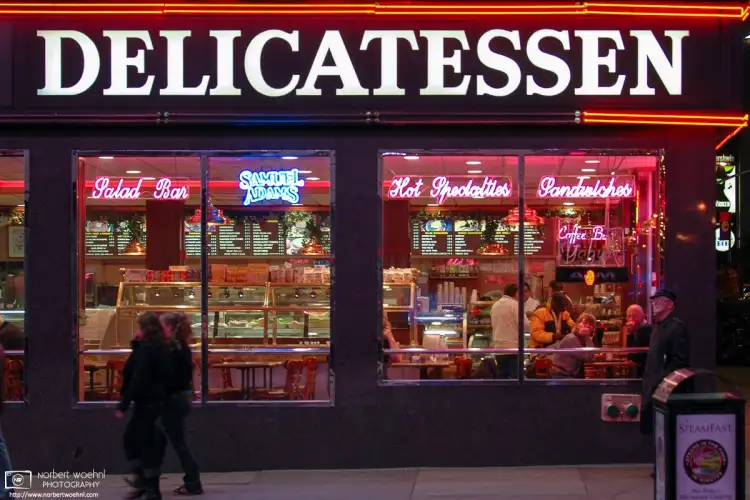 An evening peek into a Deli on the corner of 7th Avenue and West 49th Street, a few blocks northeast of Times Square.