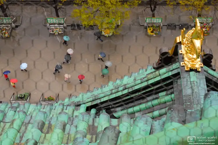 Patterns and textures as seen while looking down from the main tower of Osaka Castle in Japan on a rainy day.
