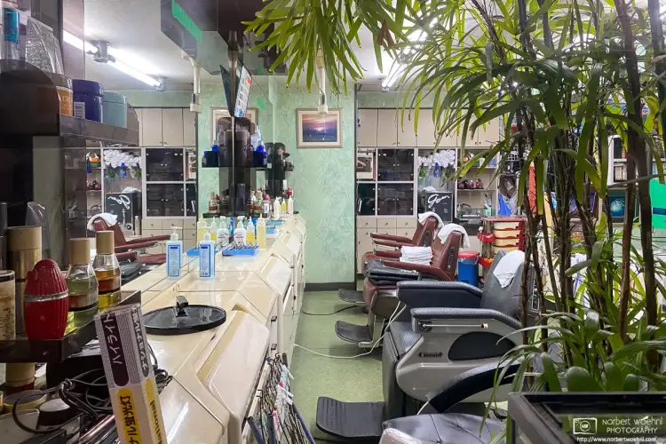 A retro-style interior as seen through the window of a barbershop in Ōtsuka, Tokyo, Japan.