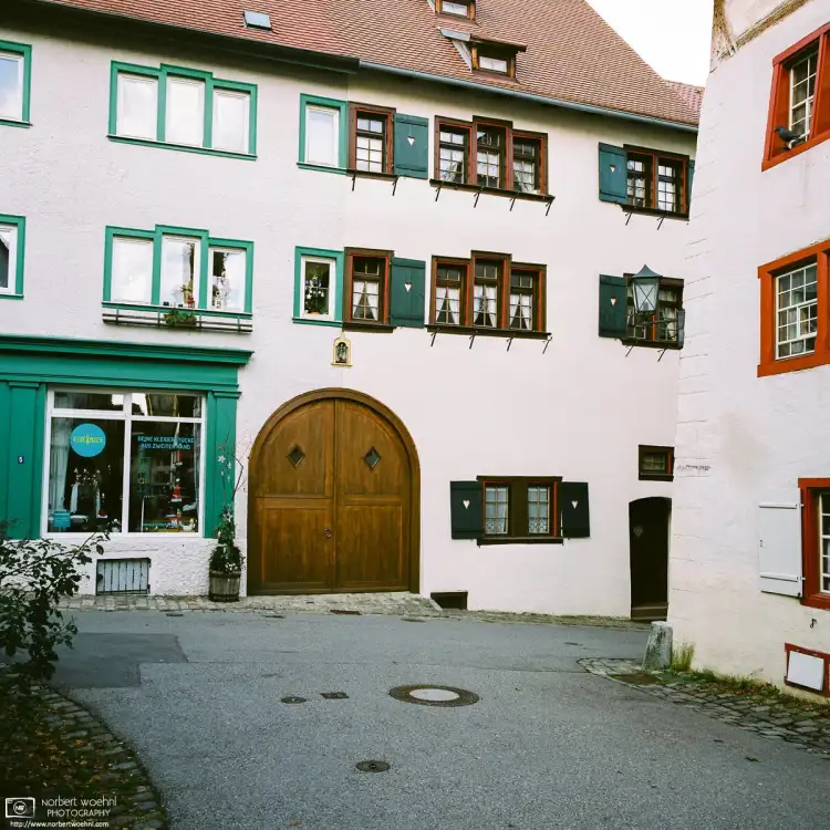 In the historic center of the southwest-German town of Rottweil, two renovated medieval buildings are forming part of a T-shaped road crossing.