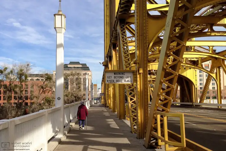 A southeast-bound view across Sacramento Tower bridge, with the California State Capitol visible in the background.