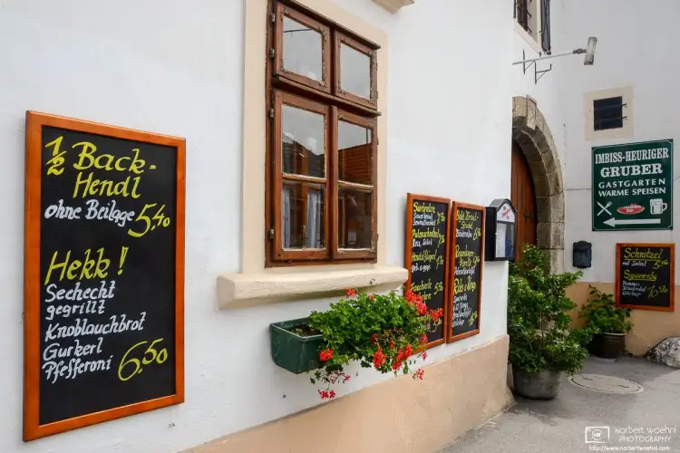 Signboards advertising the day’s menu outside a local pub in Sankt Margarethen, Burgenland, Austria.